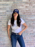 Navy hat with White OTP (outside the perimeter) letters